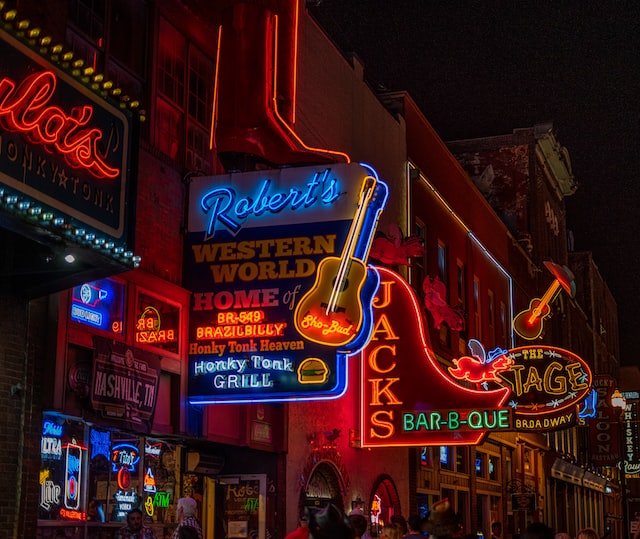 Broadway at night, lots of signs lit up