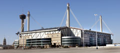 The Alamo Dome with the Tower of the Americas in the background in San Antonio, Texas